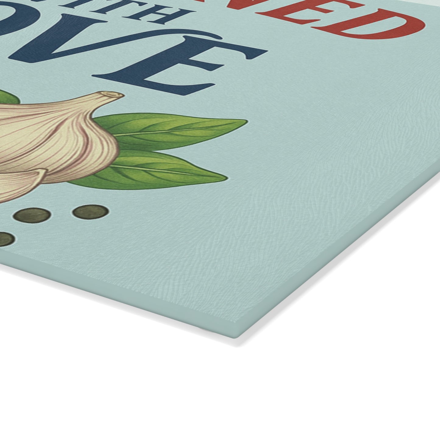 Up close of Seasoned with love glass cutting board