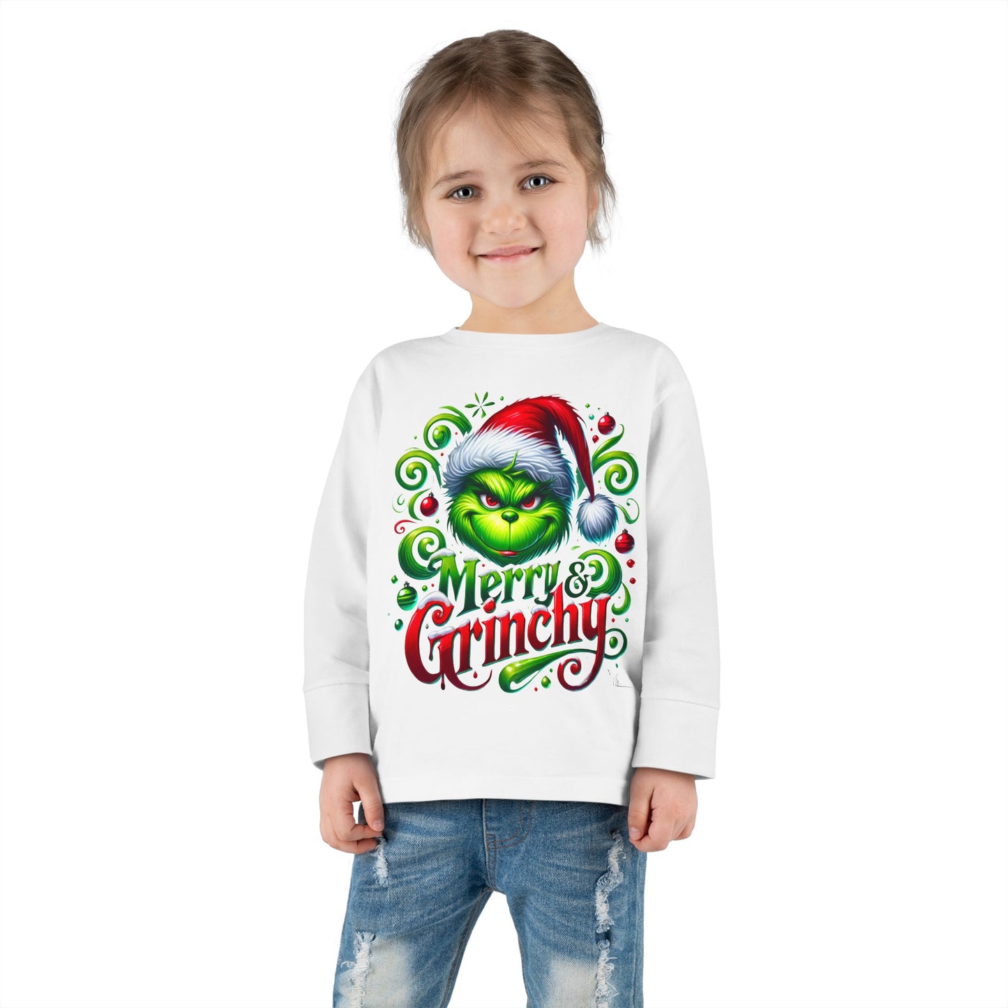 A toddler wearing a Merry Christmas Grinchy graphic tee