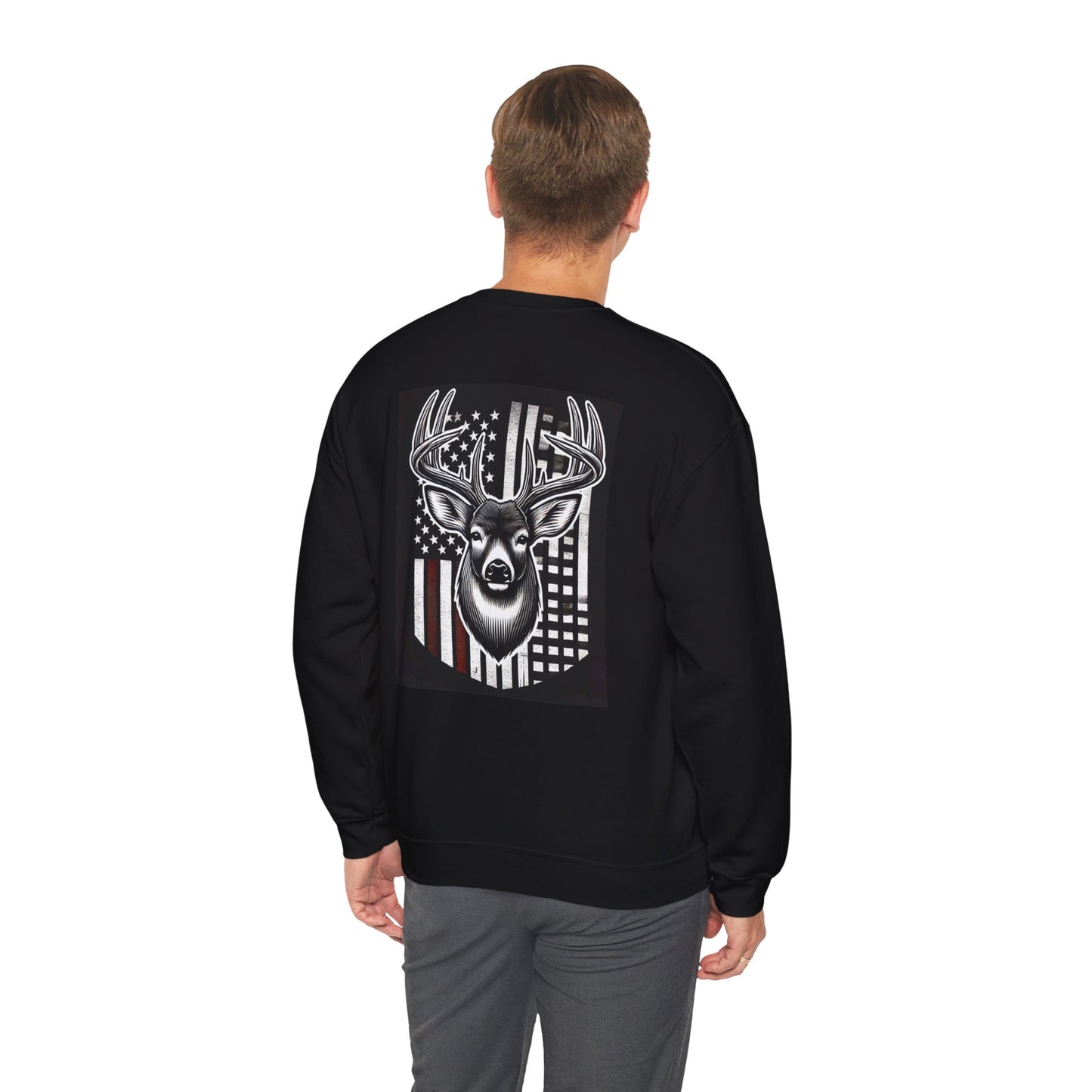 Man wearing a black shirt with graphic design of american flag and buck with jeans