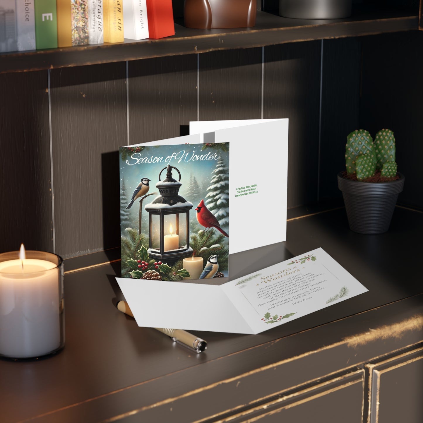 Season of Wonder Christmas card with cardinal, lantern, pinecones, and candle in a snowy winter forest